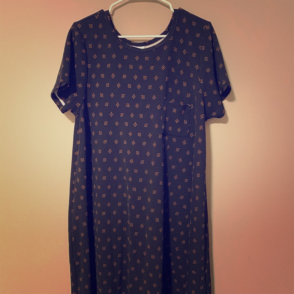 Flowy black dress with gold accent pattern